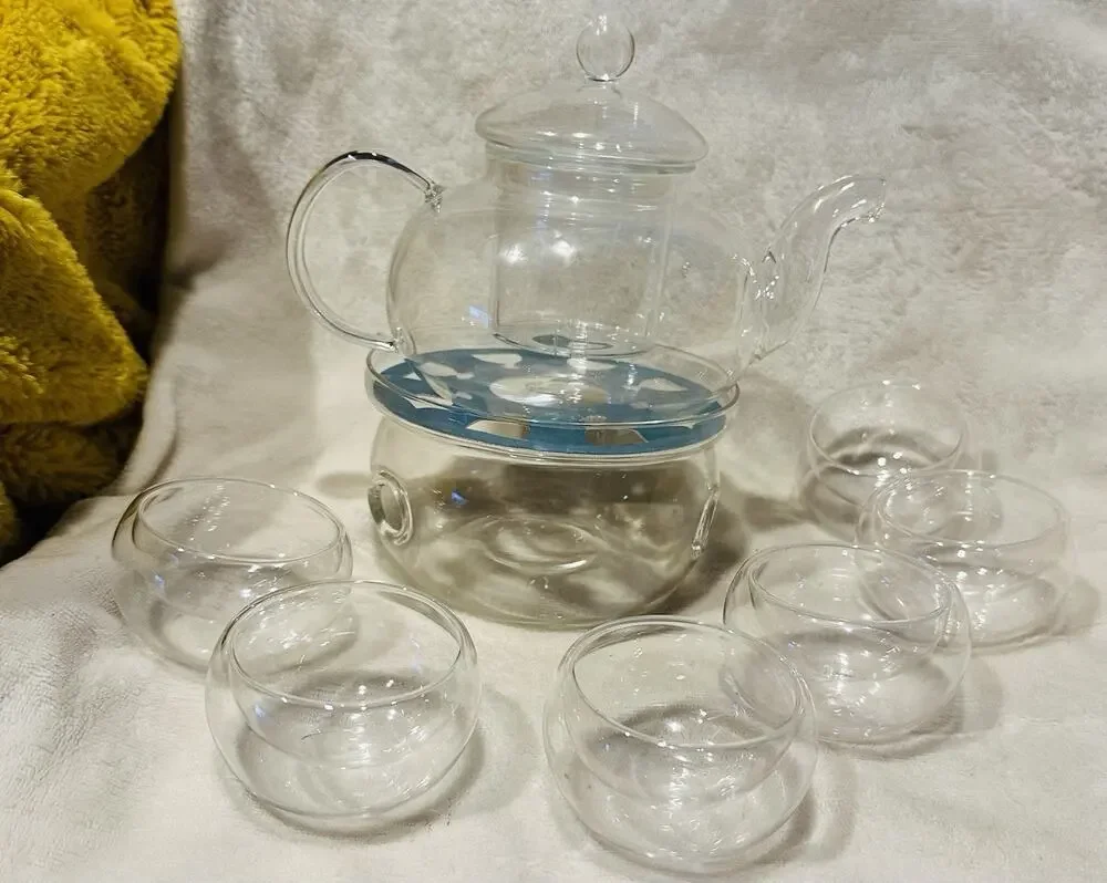 Shou Gong 27 oz glass filtering tea maker teapot with a warmer and 6 tea cups